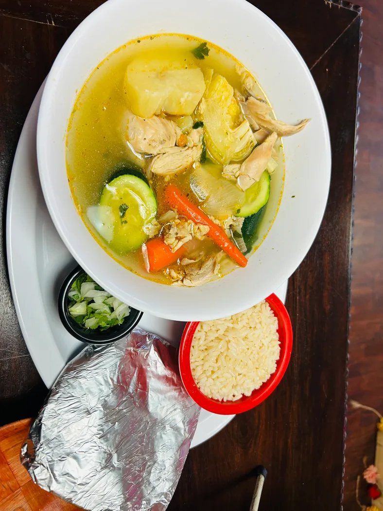 Delicious chicken soup with vegetables and rice at Jerusalen Restaurante.