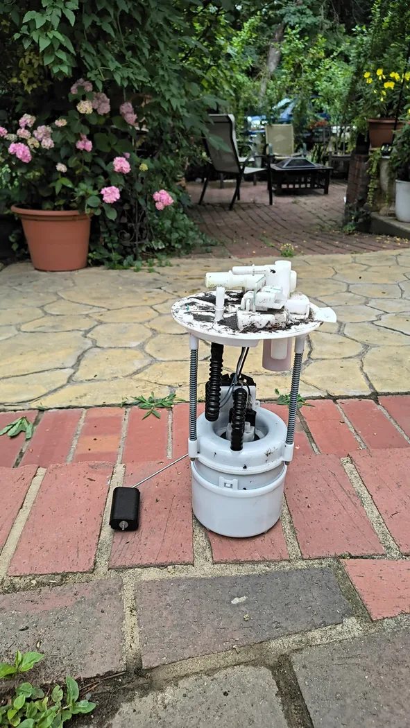 Mobile mechanic service in Concord, NC, fixing automotive parts outdoors.